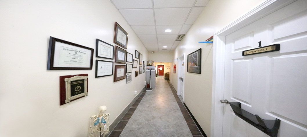 Hallway lined with Dr. Hang's diplomas and licenses